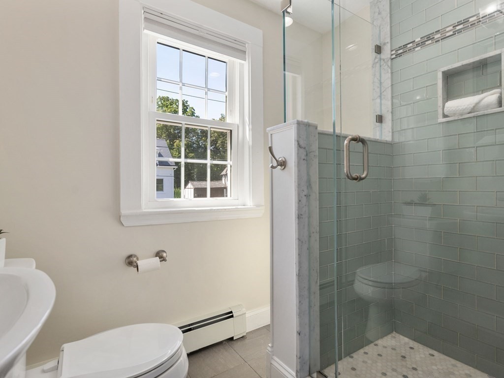 22 Howe Road Newton, MA 02459 - Photo 17 of 31 a bathroom with a toilet and a shower