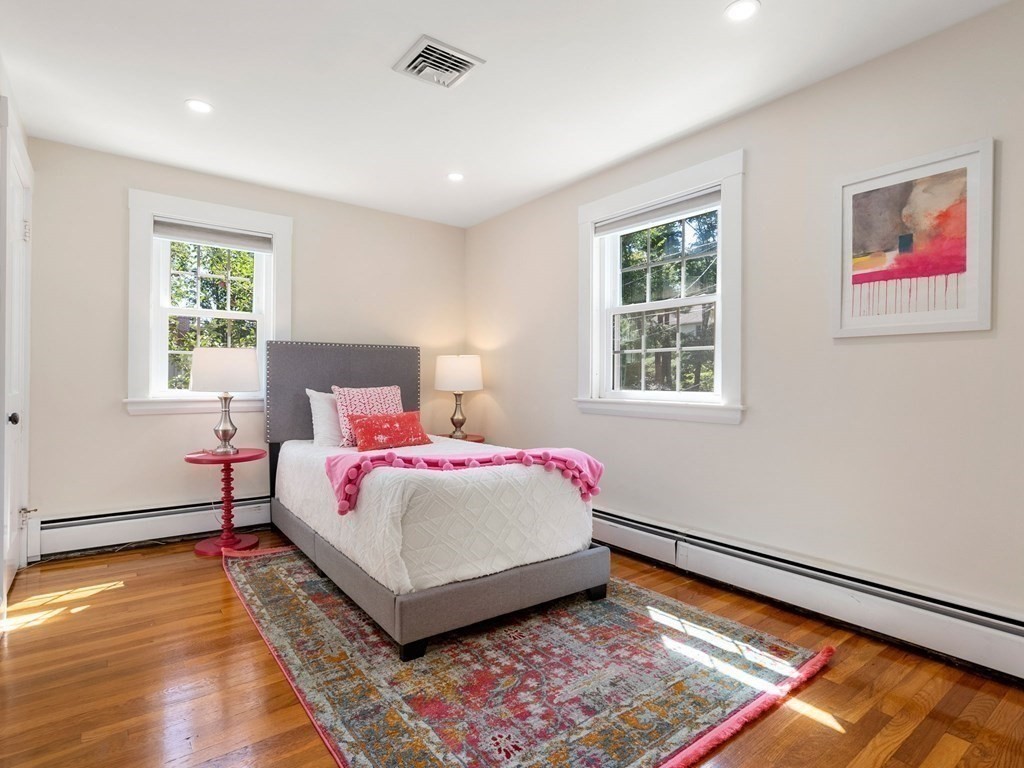 22 Howe Road Newton, MA 02459 - Photo 18 of 31 a bedroom with a bed and a window