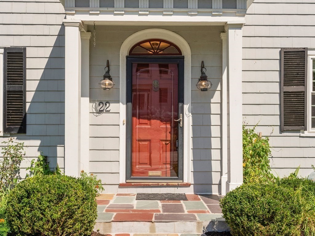 22 Howe Road Newton, MA 02459 - Photo 3 of 31 a front view of a house with a glass door