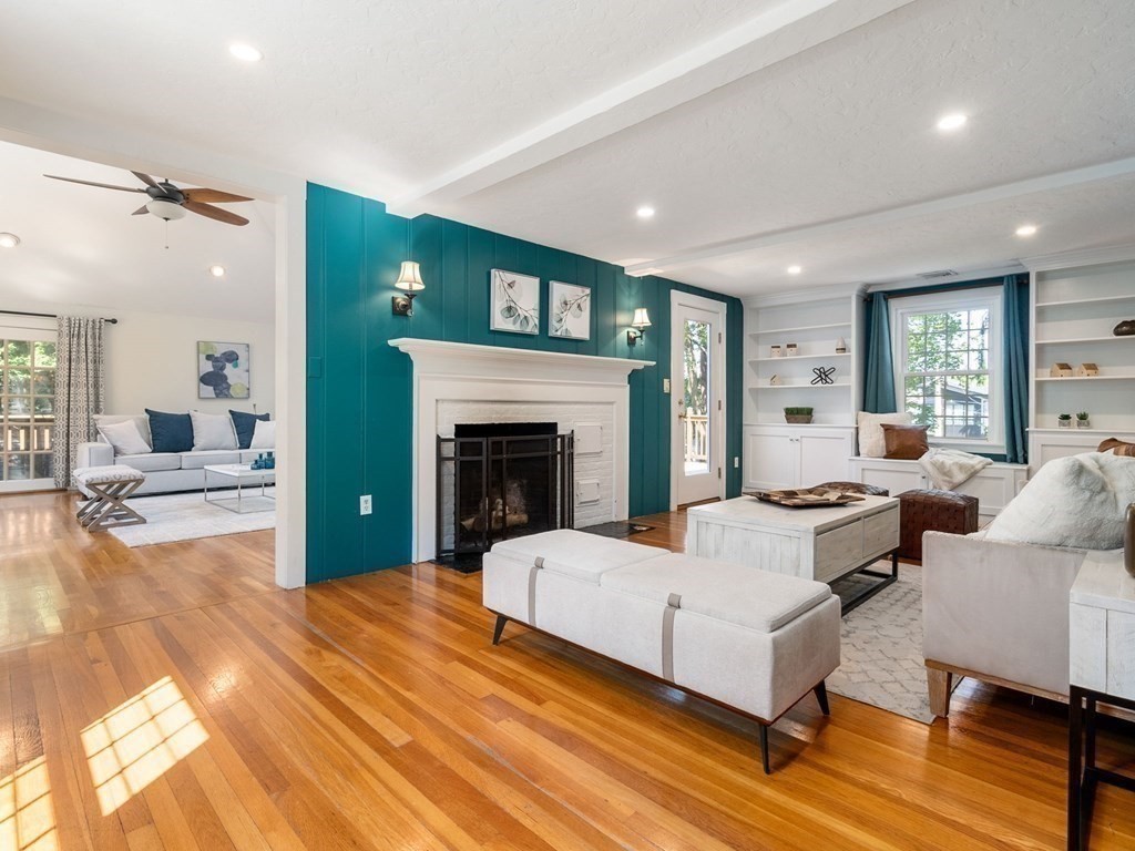 22 Howe Road Newton, MA 02459 - Photo 7 of 31 a living room with furniture and a fireplace