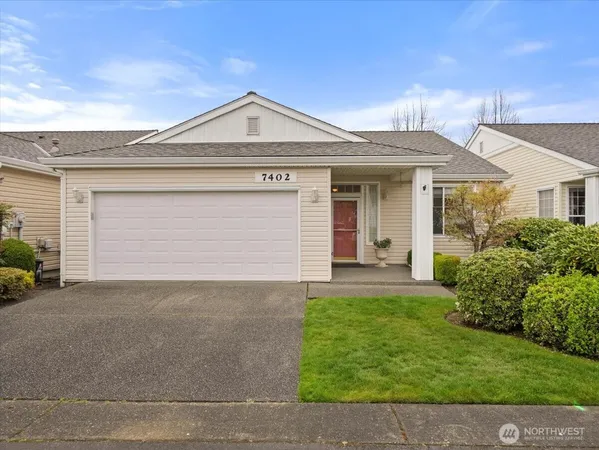 front view of a house with a yard