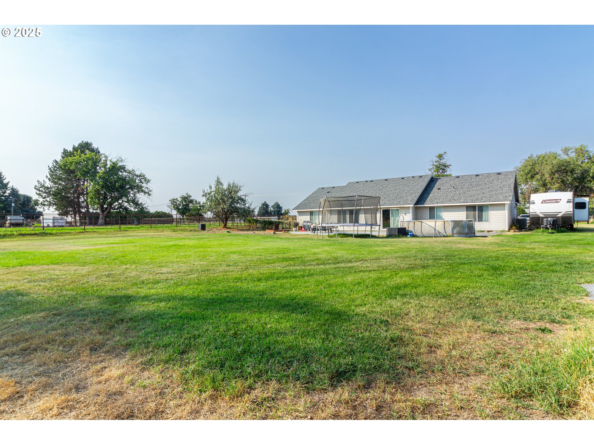 1815 Minnehaha Road Hermiston, OR 97838 - Photo 24 of 34 a front view of a house with garden
