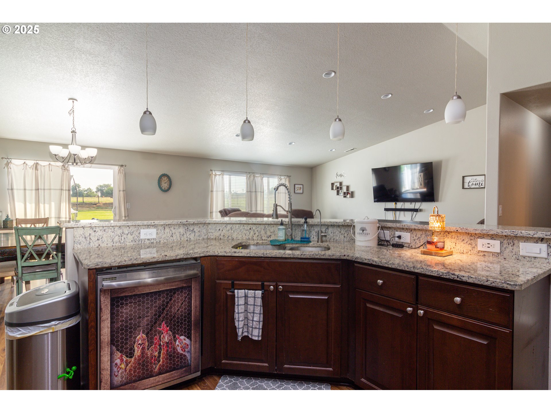 1815 Minnehaha Road Hermiston, OR 97838 - Photo 29 of 34 a kitchen with granite countertop a sink and cabinets