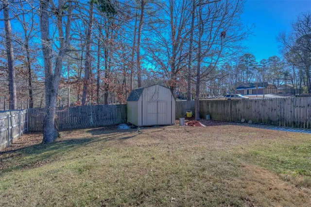 a backyard of a house with lots of green space