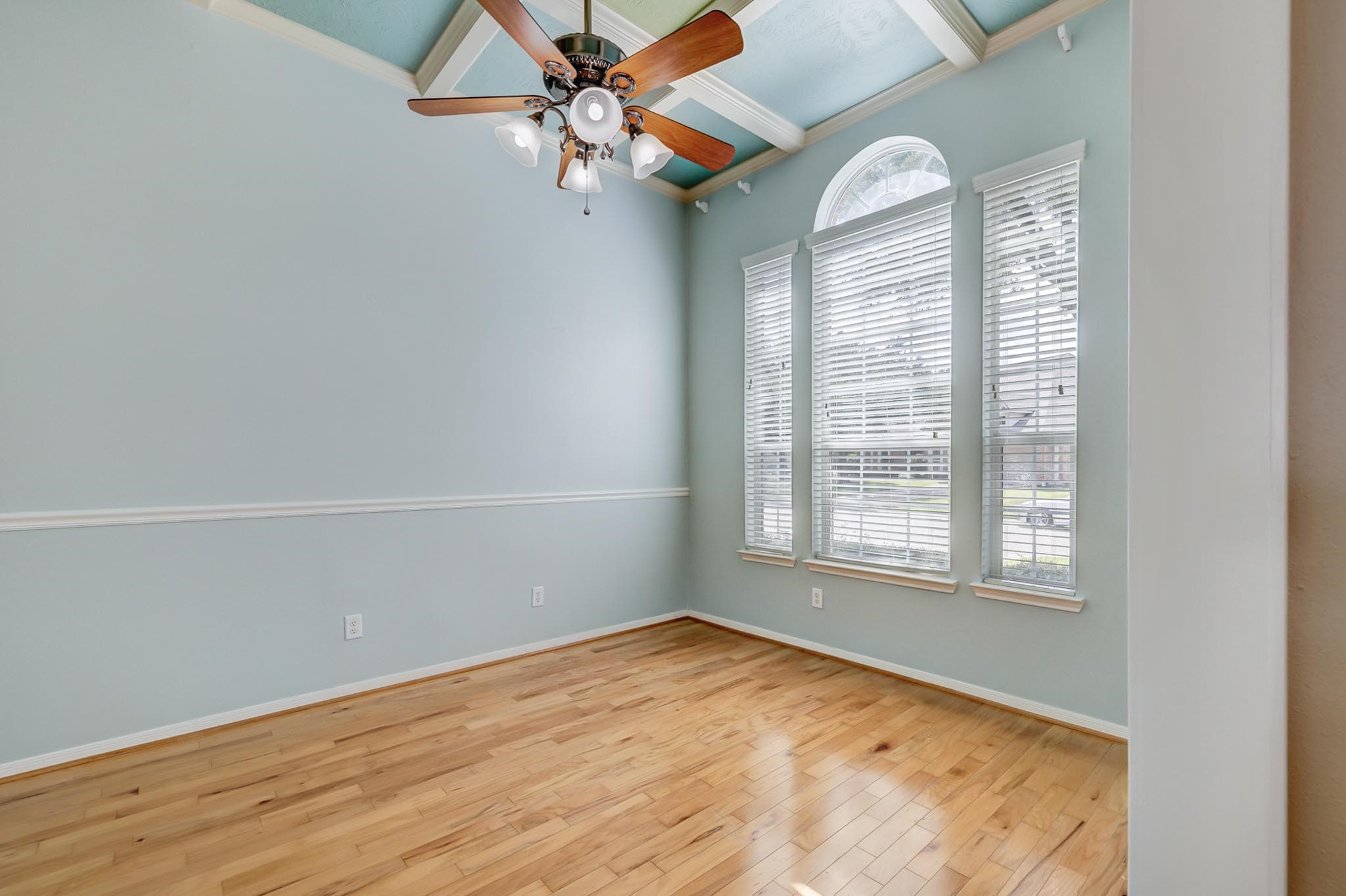 18606 Spring Heather Court Spring, TX 77379 - Photo 12 of 50 Welcome to your home office, with a plethora of natural light this space features coffered ceilings and a ceiling fan for max convenience.