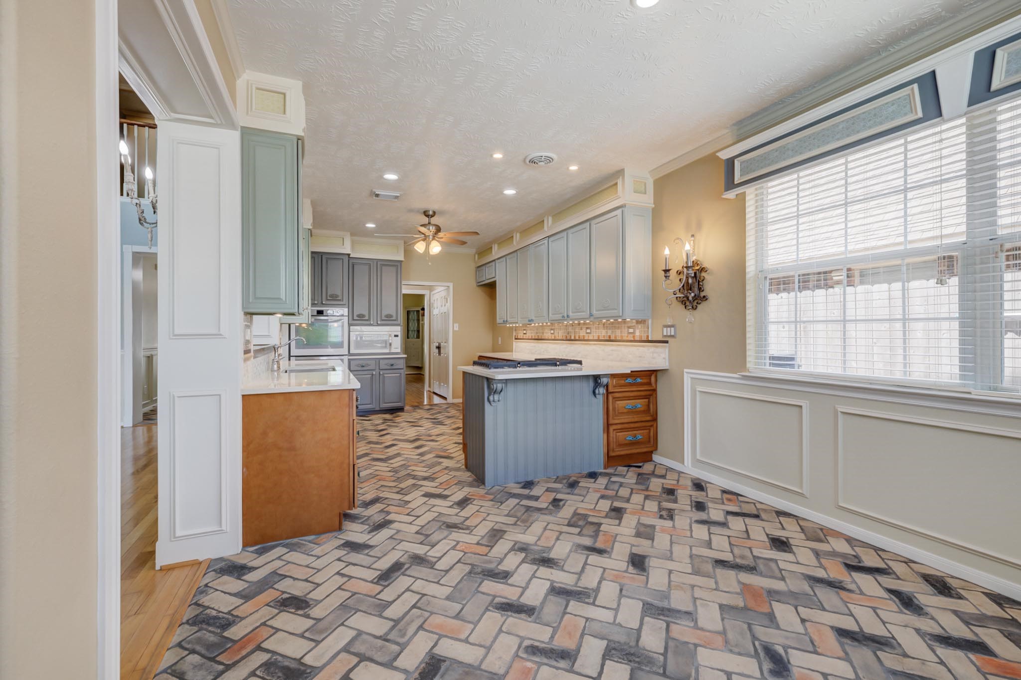 18606 Spring Heather Court Spring, TX 77379 - Photo 19 of 50 Crown molding throughout, brick flooring and plenty of space to host family and friends.