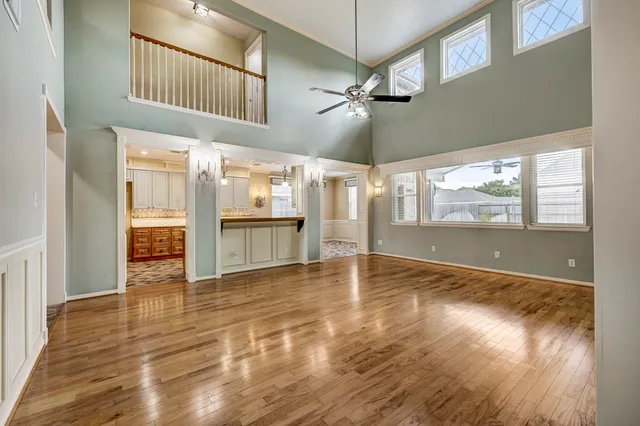 a view of a living room and wooden floor