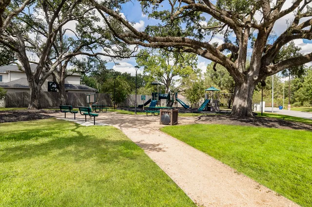 a swimming pool with outdoor seating and yard