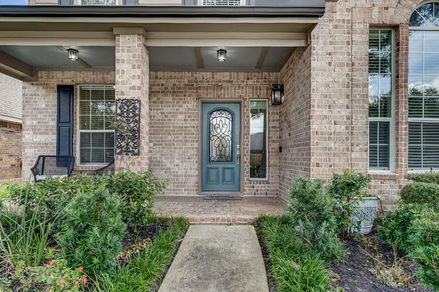 a front view of a house with a porch