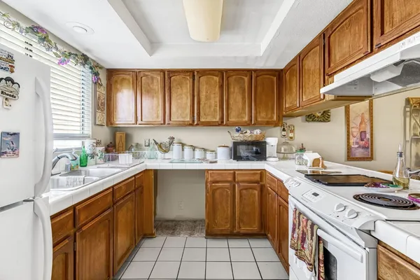 a kitchen with stainless steel appliances a refrigerator and a sink