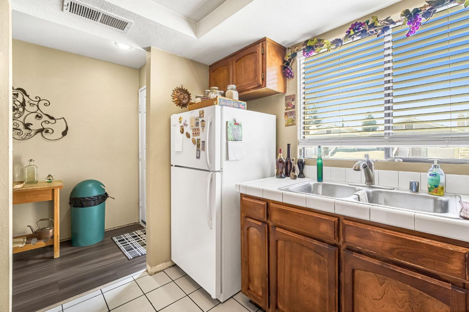 7675 North First Street, Unit 202 Fresno, CA 93720 - Photo 15 of 24 a kitchen with stainless steel appliances a refrigerator and a sink
