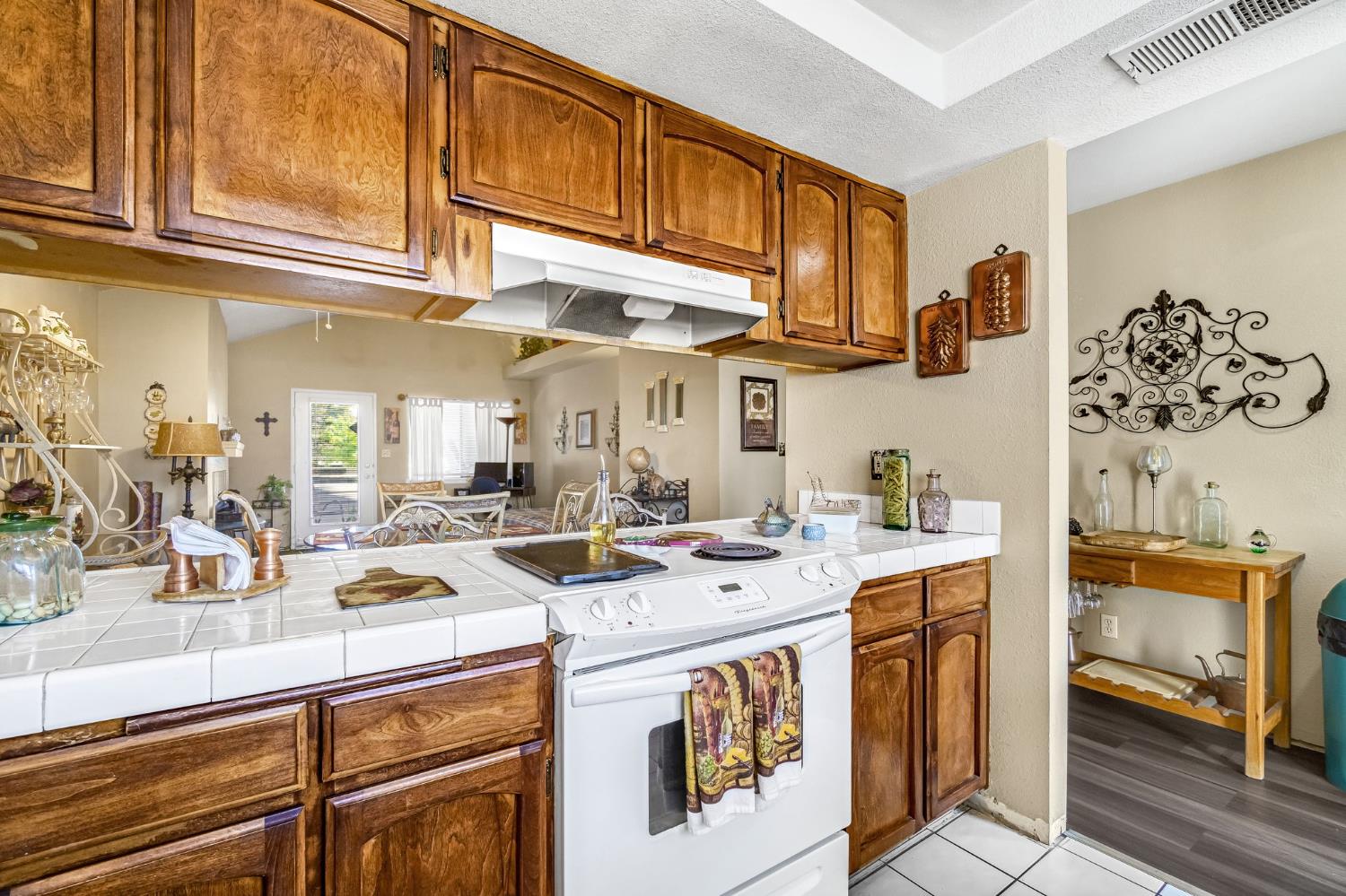 7675 North First Street, Unit 202 Fresno, CA 93720 - Photo 16 of 24 a kitchen with stainless steel appliances granite countertop a sink a stove and cabinets