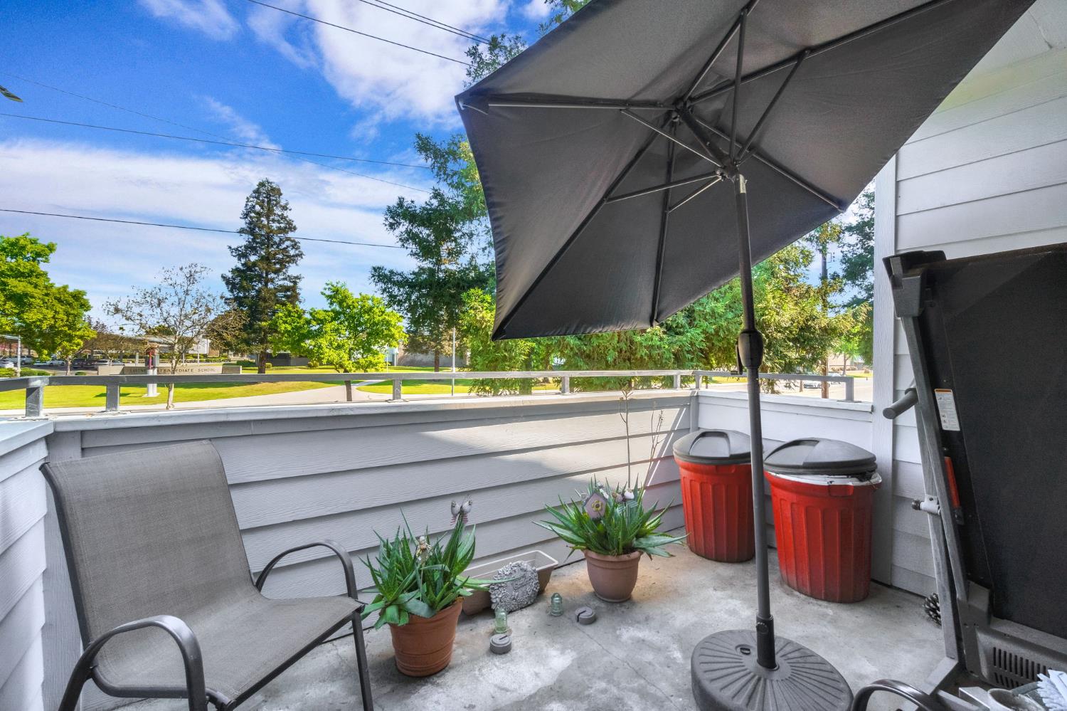 7675 North First Street, Unit 202 Fresno, CA 93720 - Photo 24 of 24 a view of a patio with furniture and a potted plants
