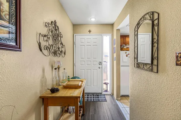 a view of a livingroom with furniture and hardwood floor