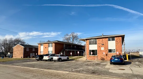 a view of a car parked in front of a house