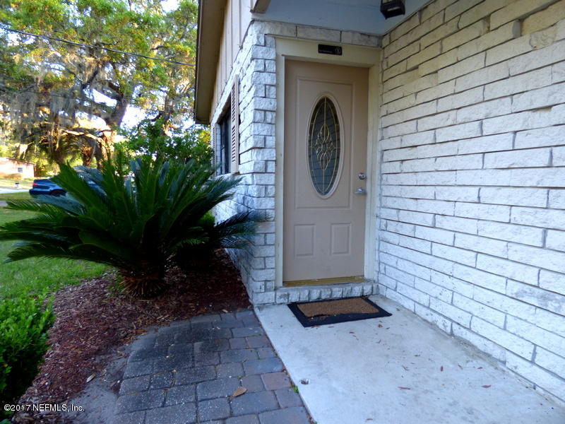 299 Capella Road Orange Park, FL 32073 - Photo 3 of 26 a front view of a house with a yard