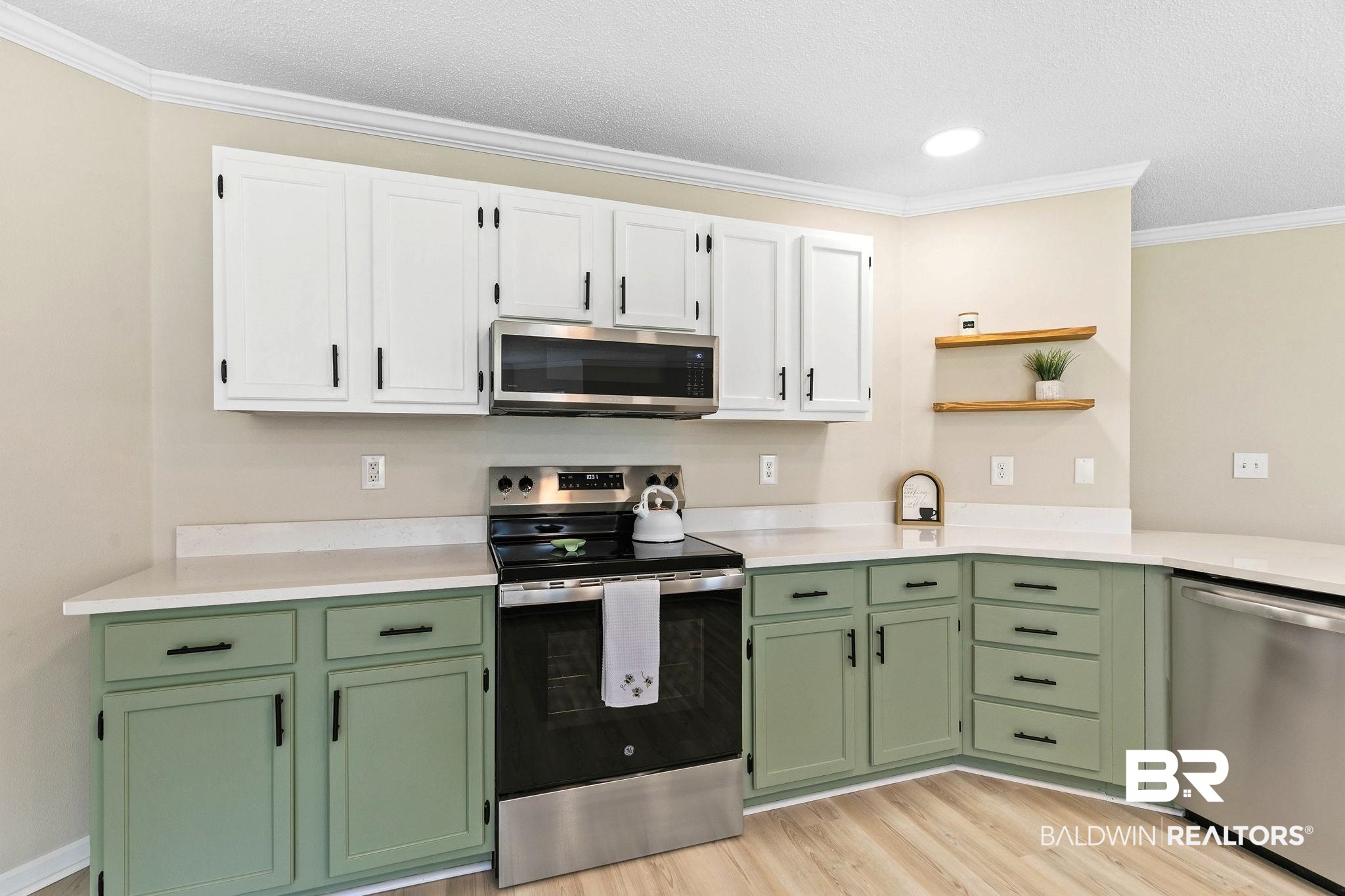 35650 Spring Road North Stapleton, AL 36578 - Photo 13 of 70 Kitchen with green cabinetry, stainless steel appliances, ornamental molding, white cabinetry, and light wood-type flooring