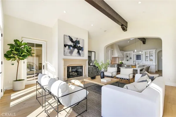 a living room with furniture fireplace and window