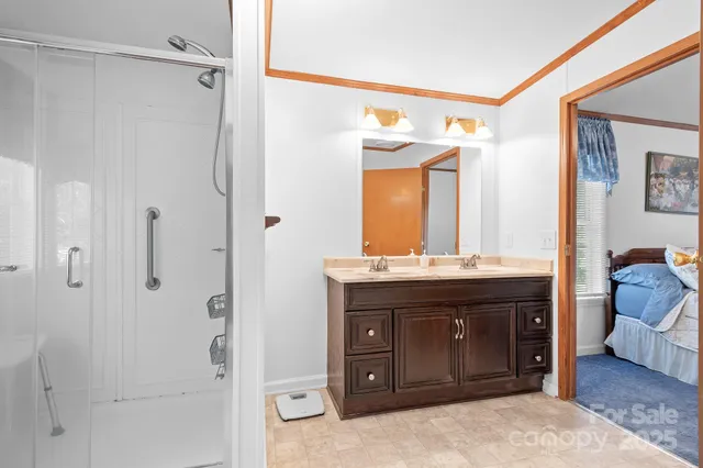 a bathroom with a granite countertop sink mirror and a