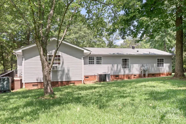 a front view of a house with a garden and porch