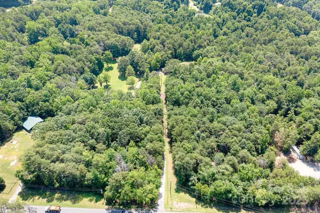 a view of a garden with a house