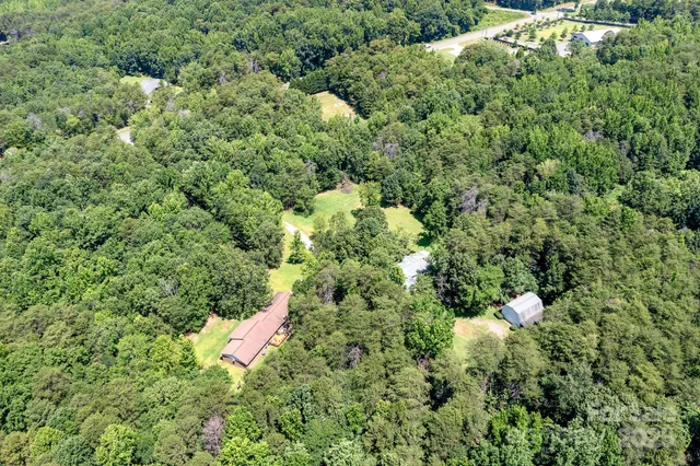 a view of a house with a tree