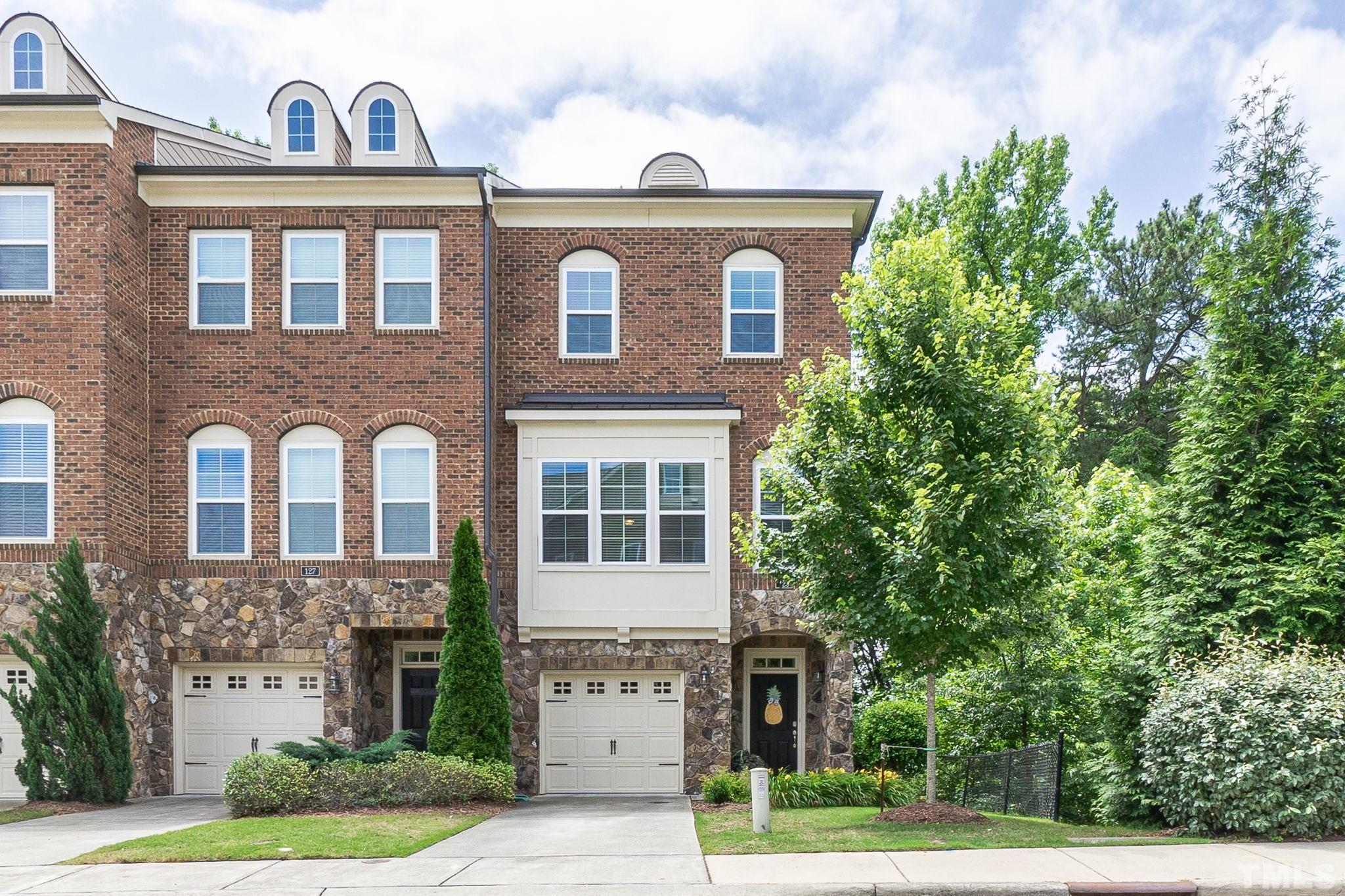 129 Penley Circle Raleigh, NC 27609 - Photo 1 of 43 a front view of a house with garden
