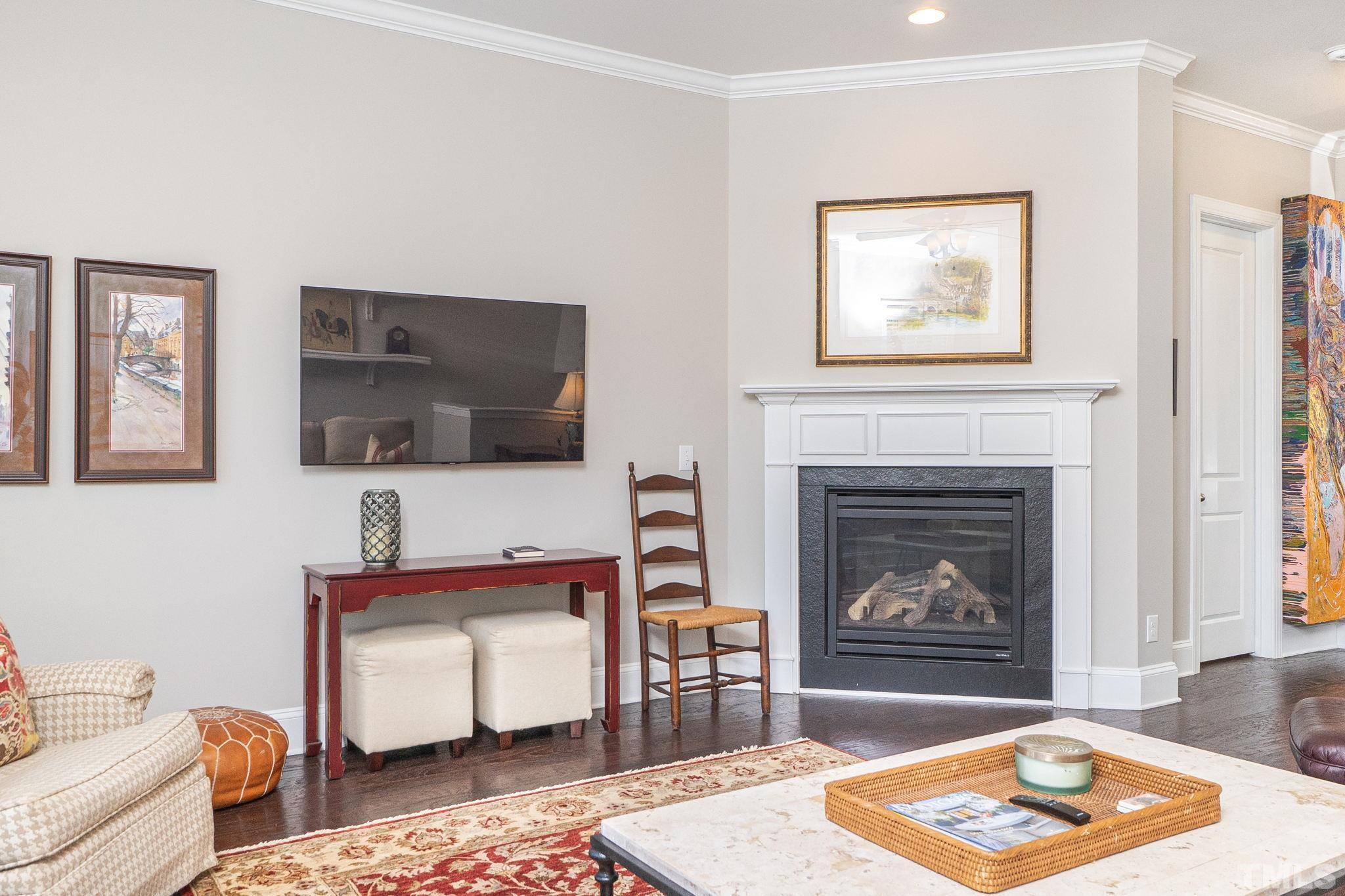 129 Penley Circle Raleigh, NC 27609 - Photo 11 of 43 a living room with furniture and a fireplace