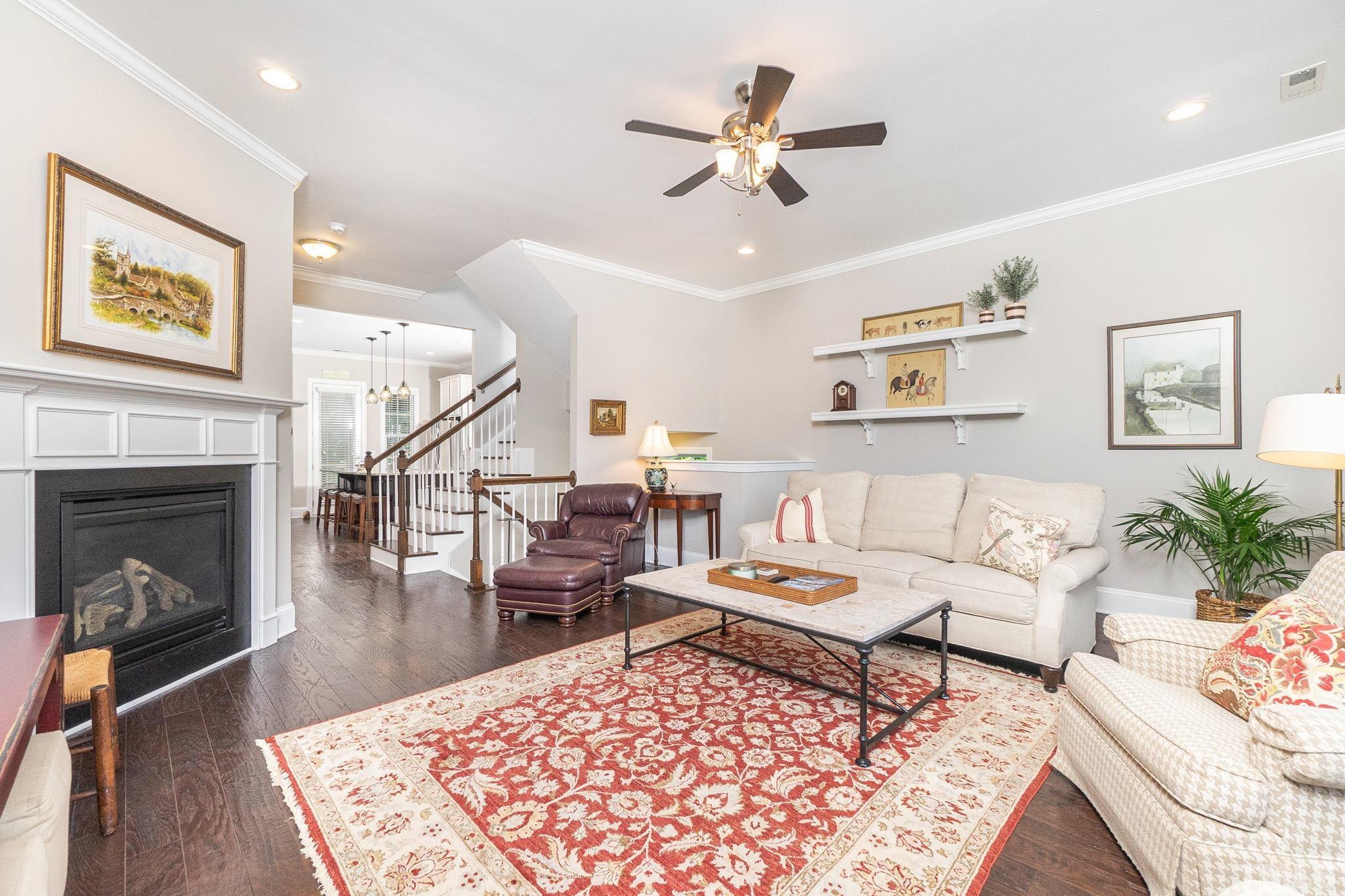 129 Penley Circle Raleigh, NC 27609 - Photo 12 of 43 a living room with furniture and a fireplace