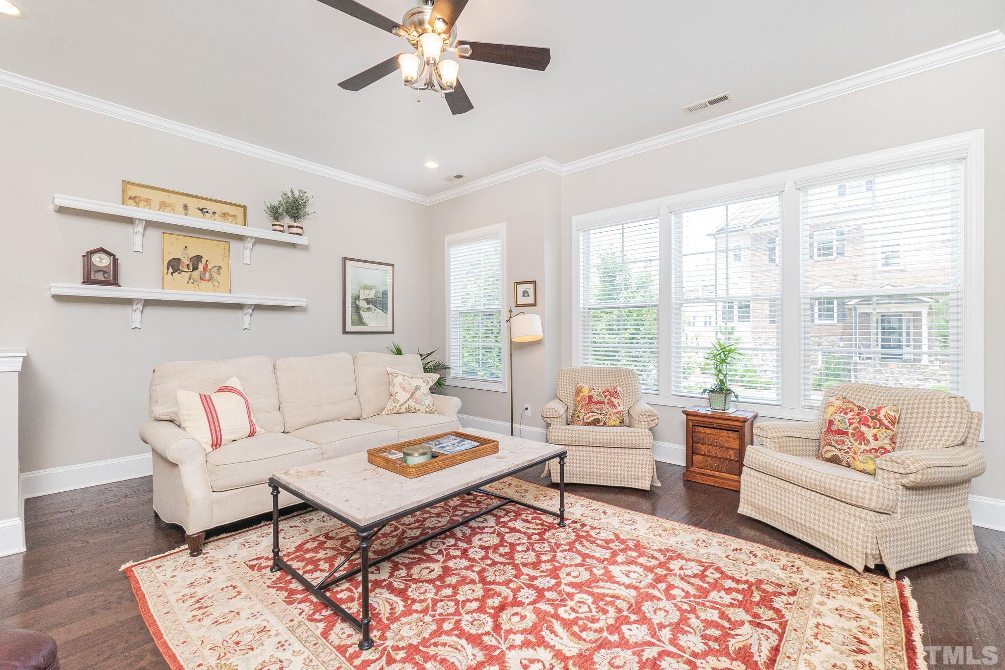129 Penley Circle Raleigh, NC 27609 - Photo 13 of 43 a living room with furniture and a rug
