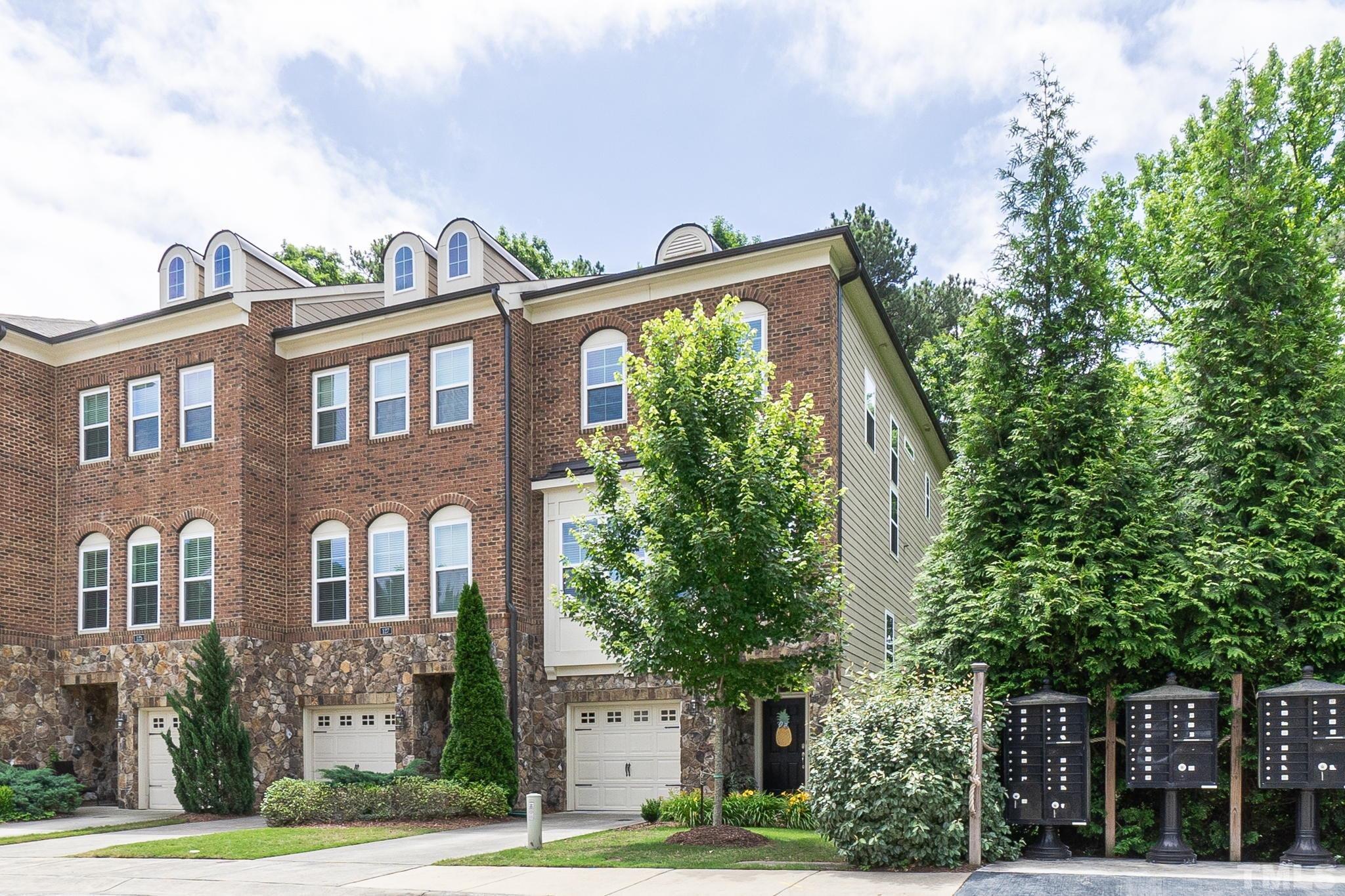 129 Penley Circle Raleigh, NC 27609 - Photo 2 of 43 a front view of a house with garden