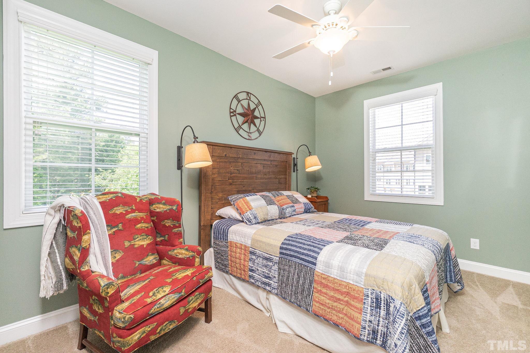 129 Penley Circle Raleigh, NC 27609 - Photo 26 of 43 a bedroom with double bed and window