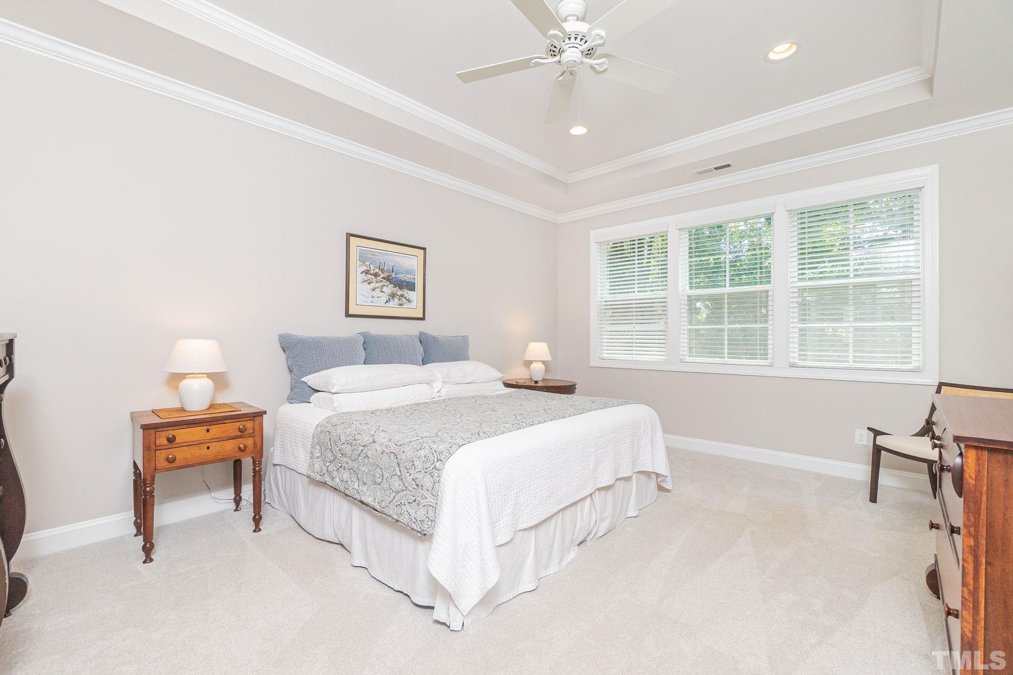 129 Penley Circle Raleigh, NC 27609 - Photo 29 of 43 a bedroom with bed and a window