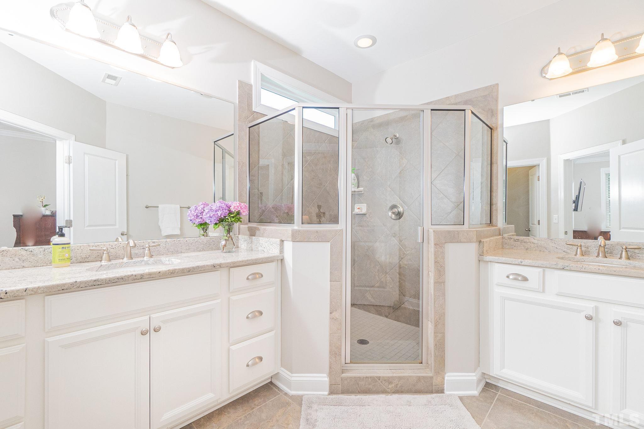 129 Penley Circle Raleigh, NC 27609 - Photo 33 of 43 a bathroom with a granite countertop sink mirror and double