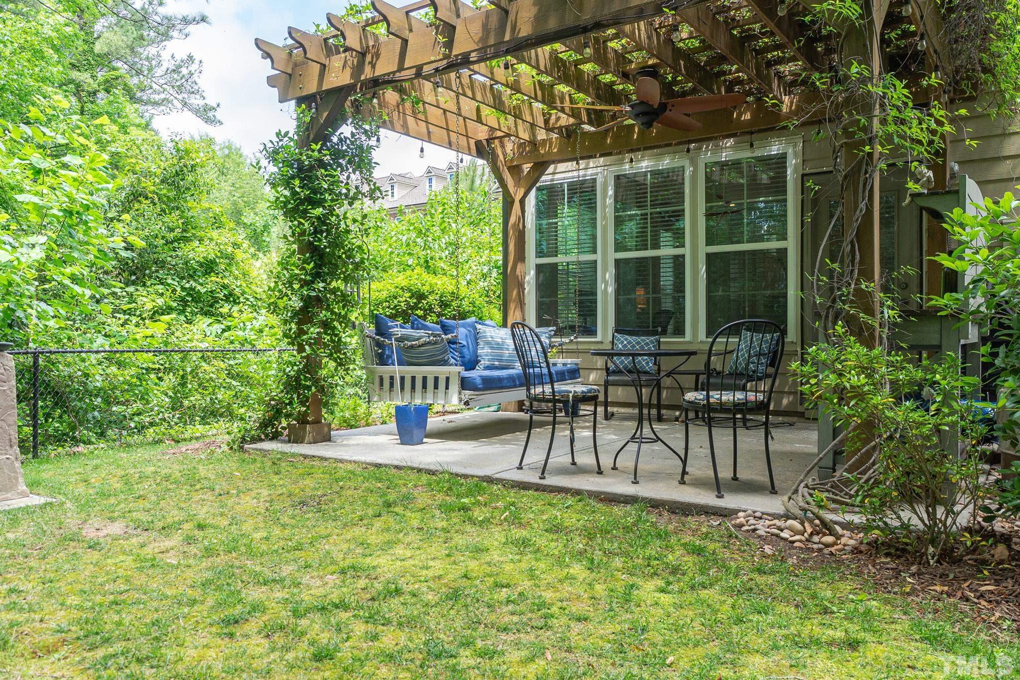 129 Penley Circle Raleigh, NC 27609 - Photo 37 of 43 a view of a chair and tables in the garden