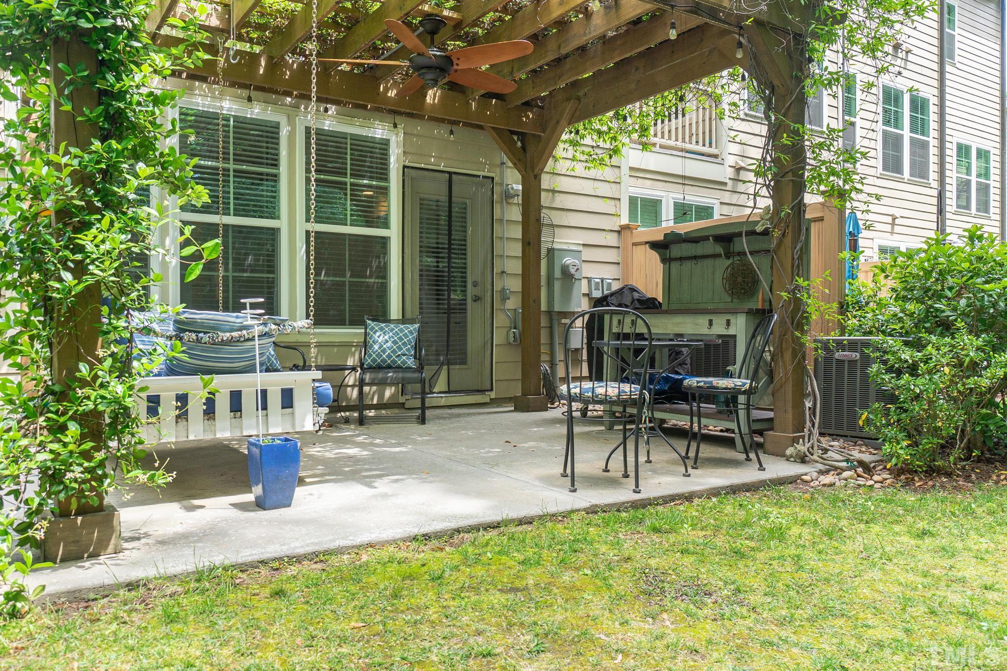 129 Penley Circle Raleigh, NC 27609 - Photo 39 of 43 a building outdoor space with patio furniture and potted plants