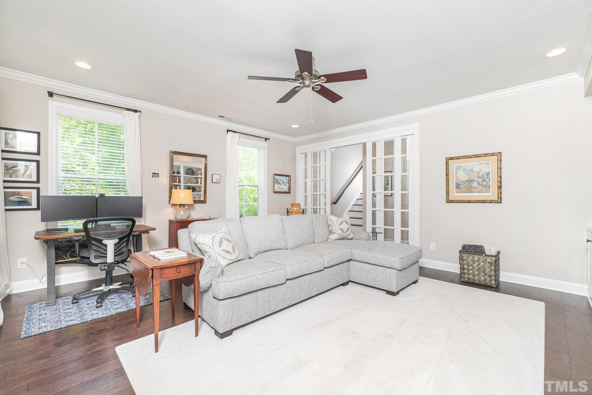 129 Penley Circle Raleigh, NC 27609 - Photo 6 of 43 a living room with furniture and a large window