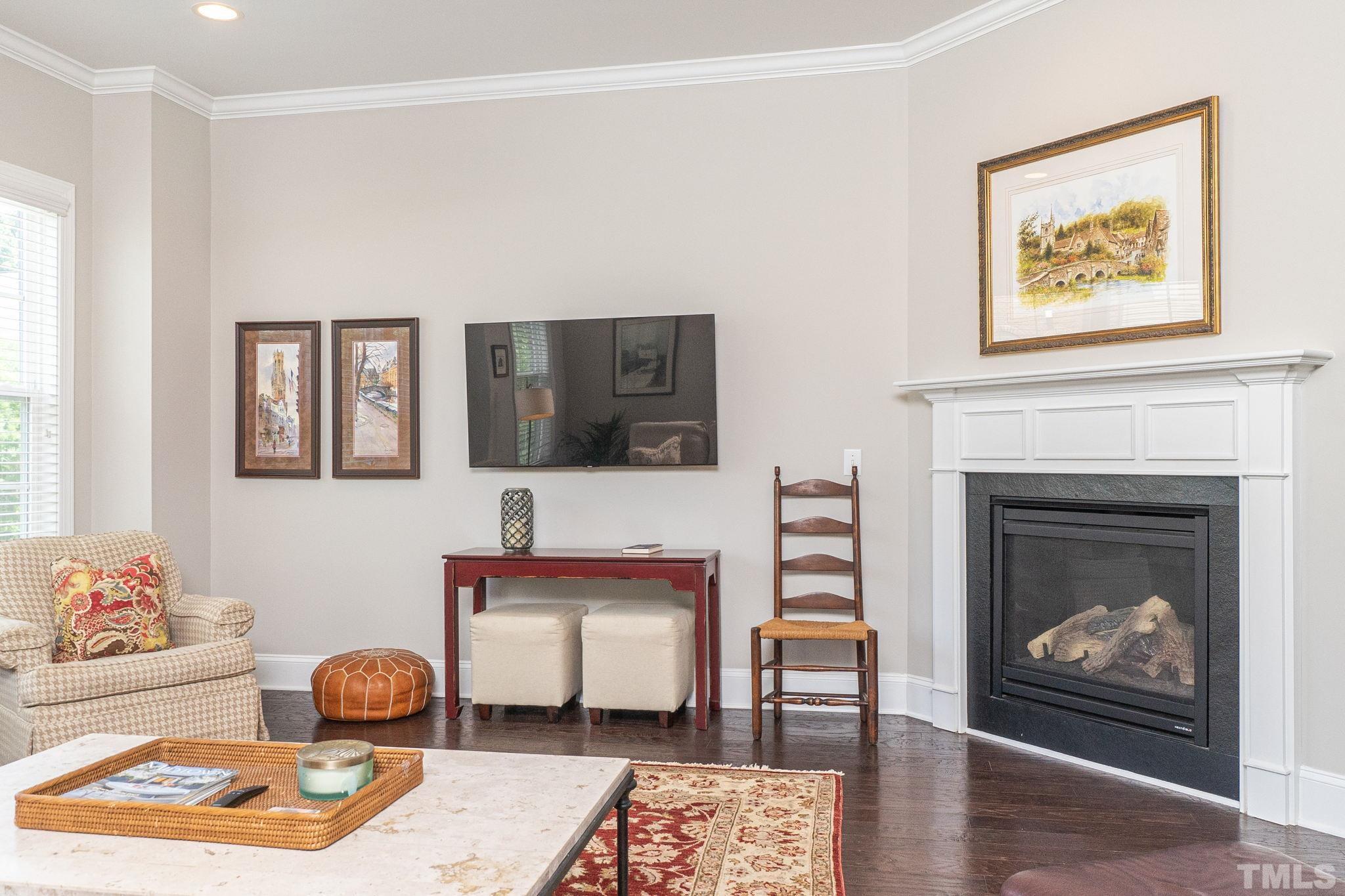129 Penley Circle Raleigh, NC 27609 - Photo 9 of 43 a living room with furniture and a fireplace