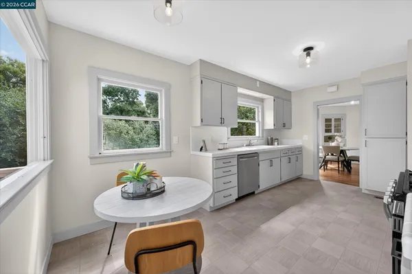 a kitchen with a sink cabinets and window