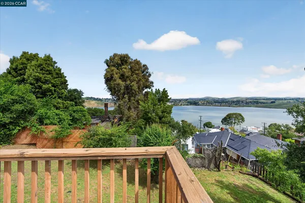 a view of a balcony with lake view and mountain view