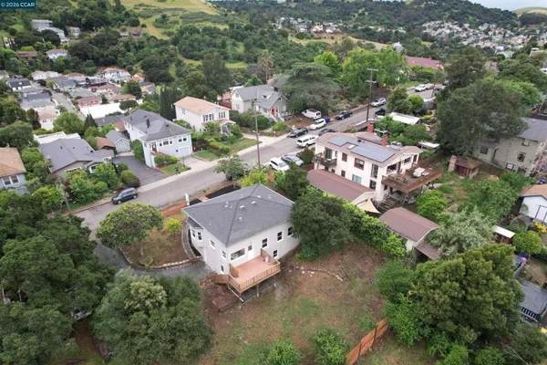 an aerial view of residential house with outdoor space