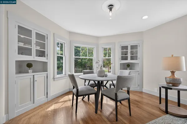 a view of a dining room with furniture window and wooden floor