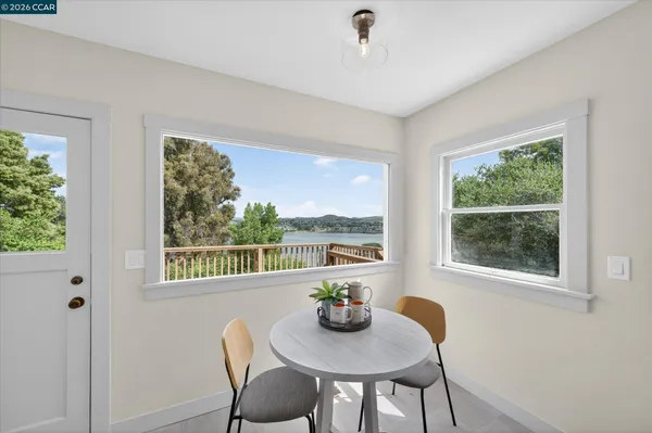 a view of a dining room with furniture window and outside view