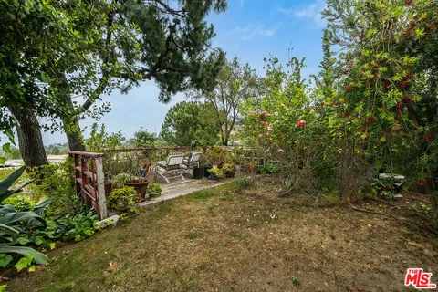 a view of a balcony with chairs