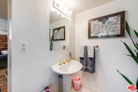 a bed room with a bed and a television