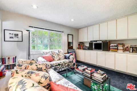 a living room with furniture and window