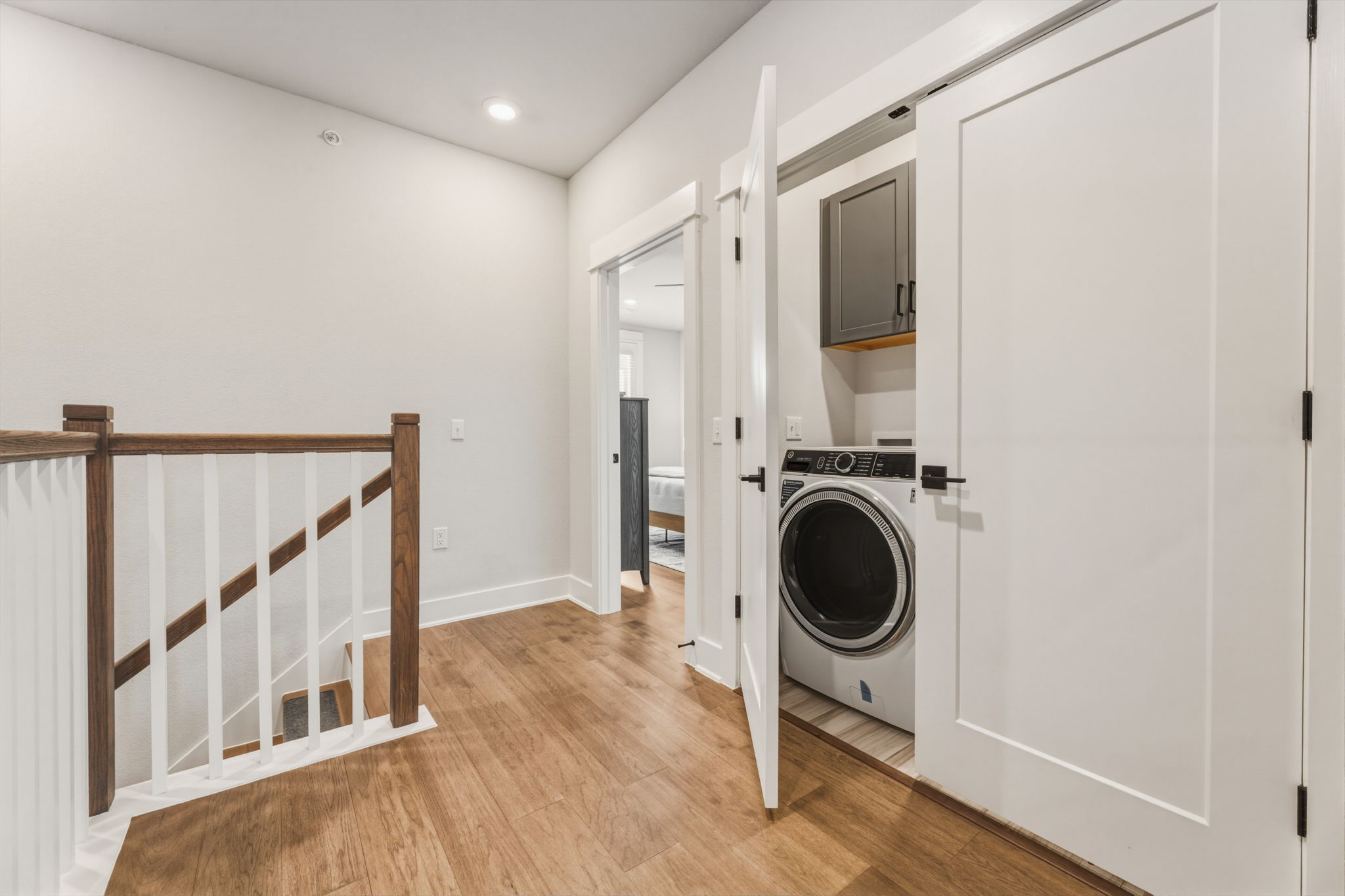 2929 Moreno Street Austin, TX 78723 - Photo 23 of 40 Hallway featuring wood-finish flooring, white walls, and recessed lighting