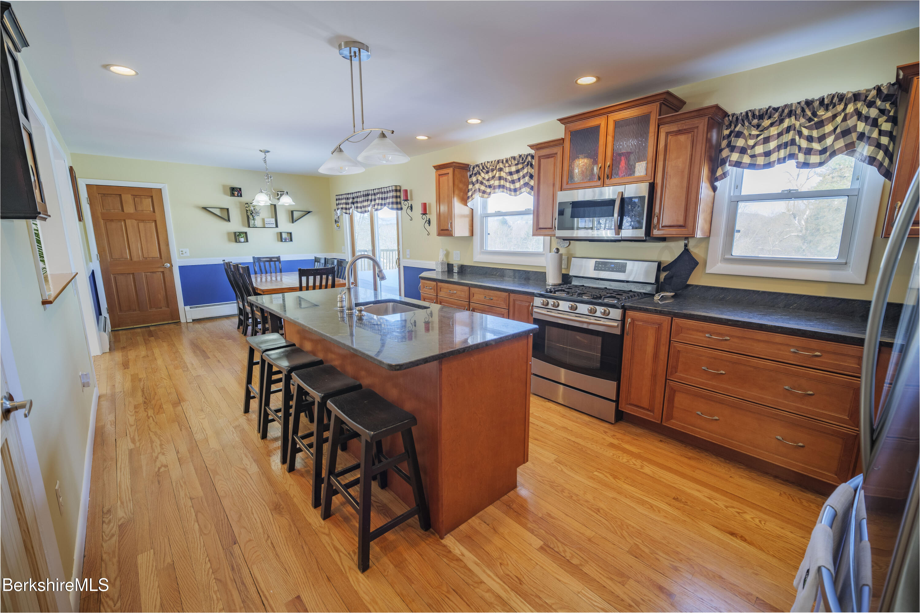 582 East New Lenox Road Pittsfield, MA 01201 - Photo 6 of 23 a kitchen with stainless steel appliances granite countertop sink stove top oven and cabinets