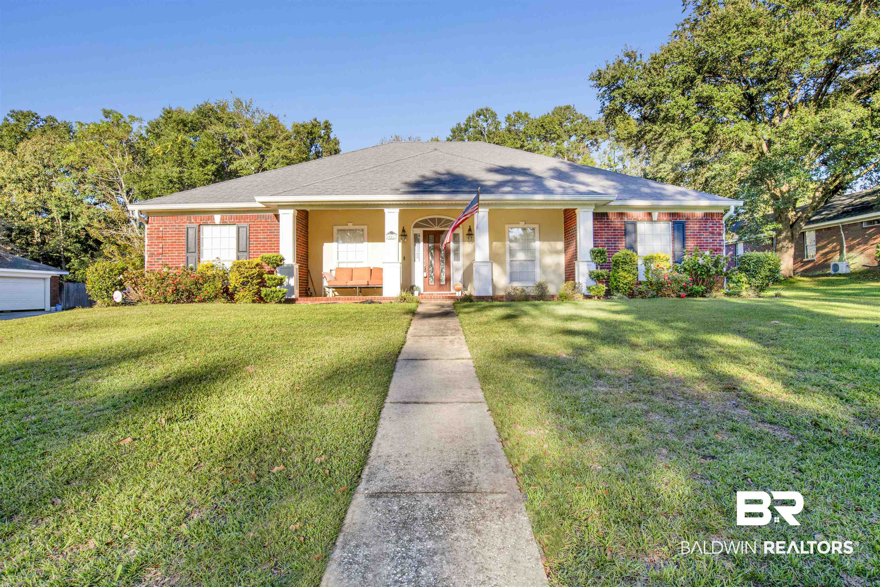 445 Wedgefield Drive South Mobile, AL 36608 - Photo 1 of 36 View of front of property featuring covered porch and a front lawn