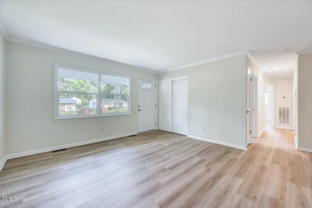a kitchen with granite countertop a sink stove and refrigerator